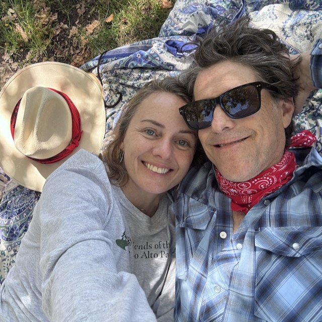 two people enjoying the shade in a local park
